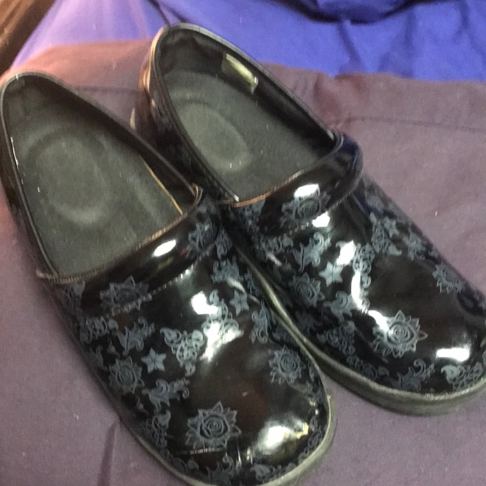 Woman’s black clog